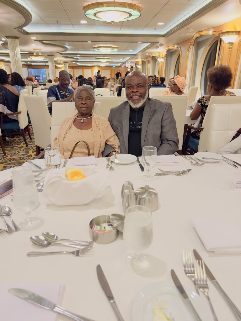 Asoh Rose Nganya at a formal cruise dinner with a loved one