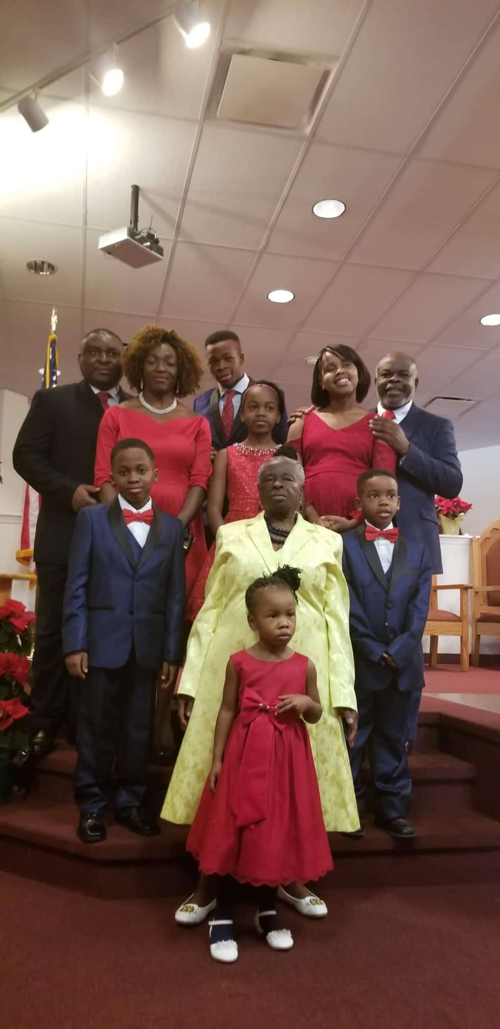 Asoh Rose Nganya surrounded by family at church