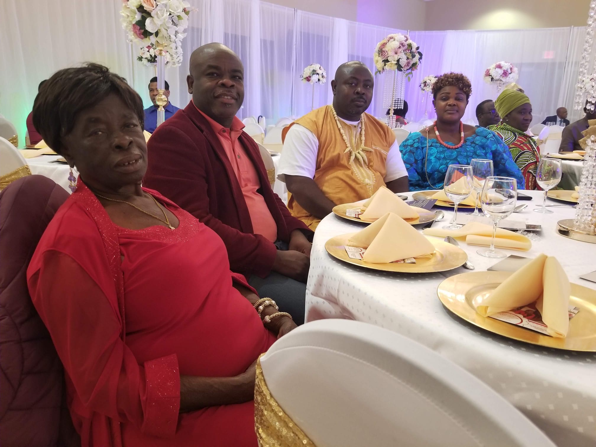 Mama Rose at an elegant gala banquet in red