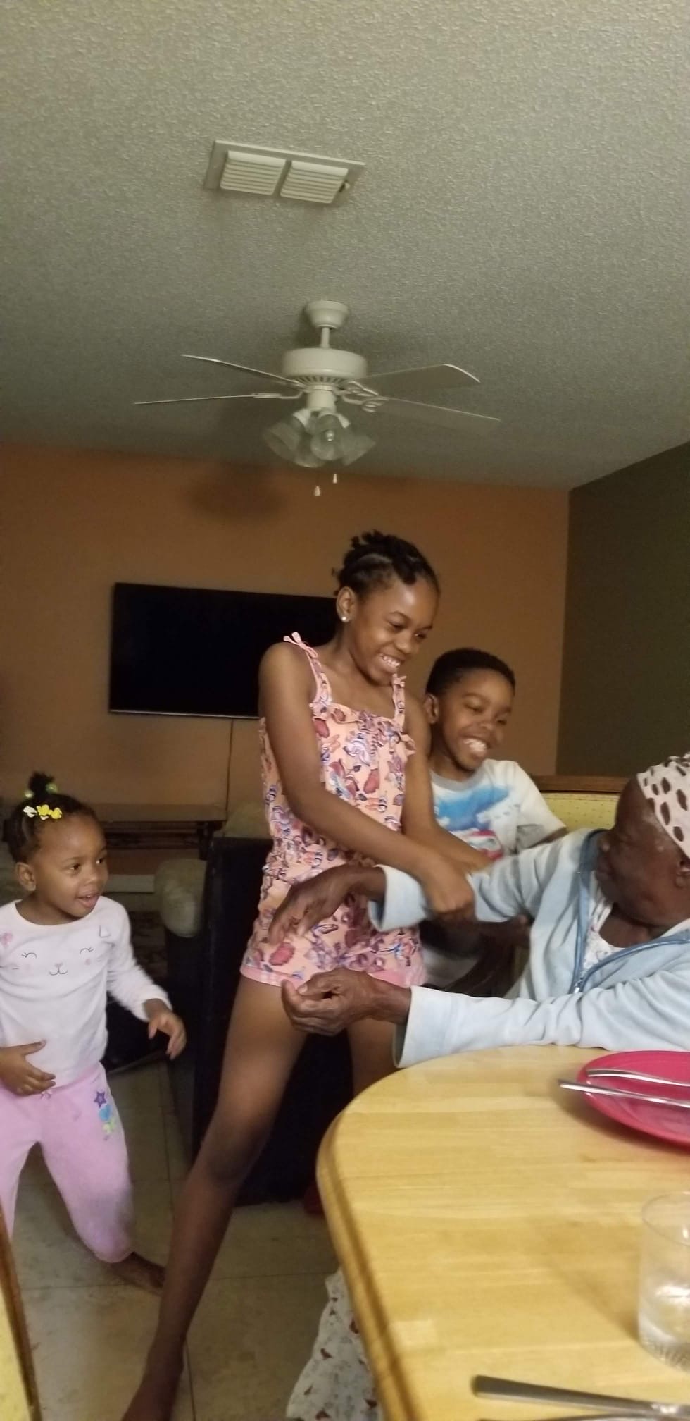 Mama Rose laughing with her grandchildren